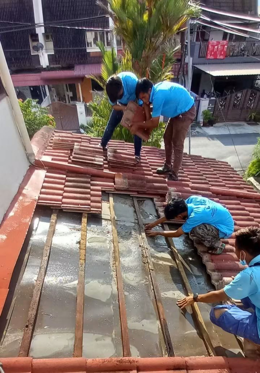 VROOF crew working on a tiled roof
